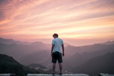 standing on a hilltop
